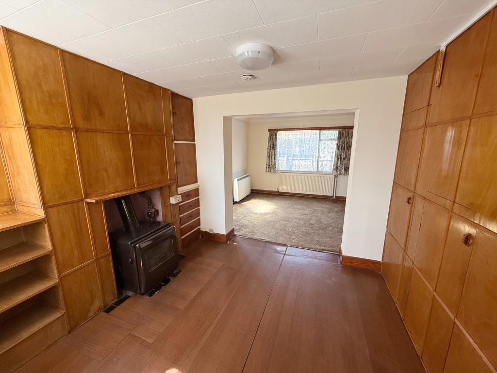 Lot: 146 - HOUSE FOR IMPROVEMENT - Dining and living rooms with wood panelling